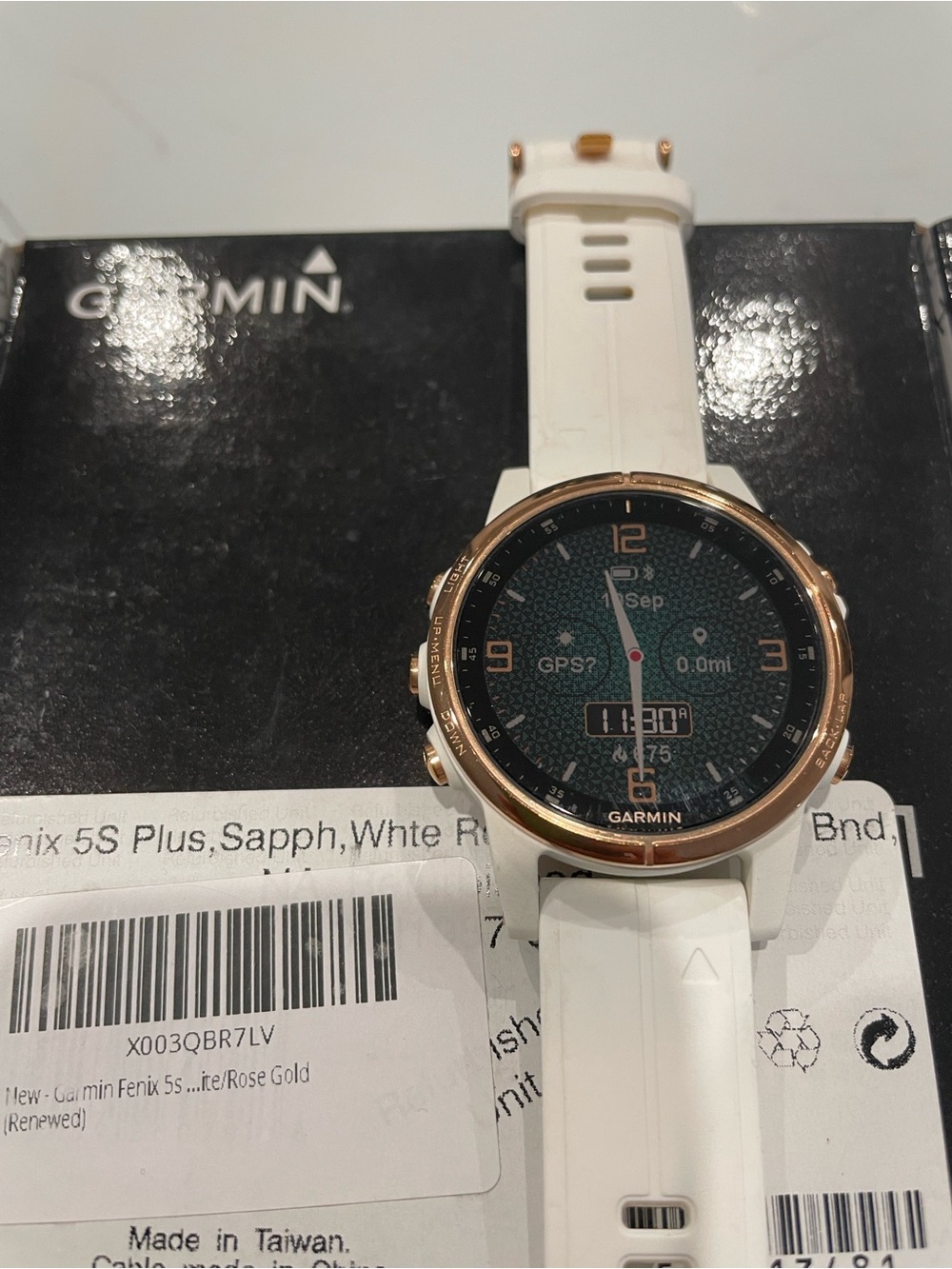Garmin Fenix 5s Plus smartwatch in white with rose gold bezel